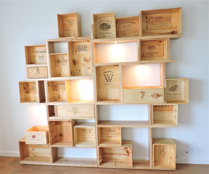Wall shelving made of lit wooden crates