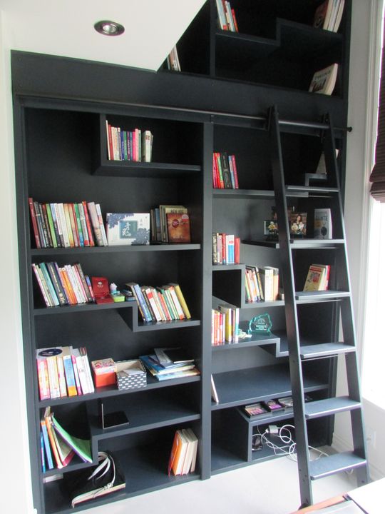 Black bookcase with a removable ladder