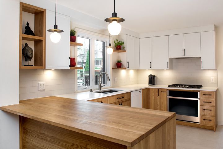 White and light wood kitchen with a wood counter