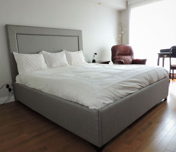 Bed with an upholstered headboard